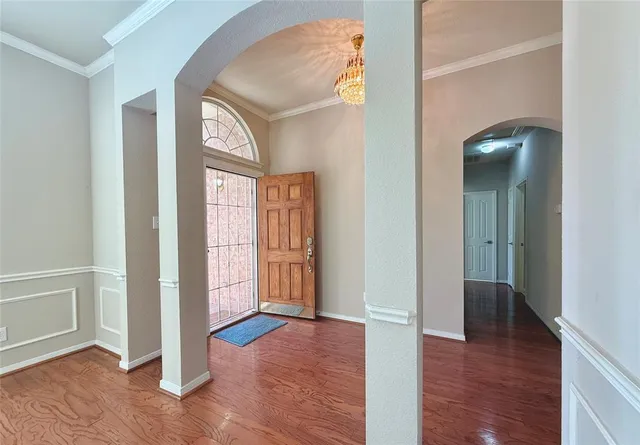 a view of entryway with wooden floor