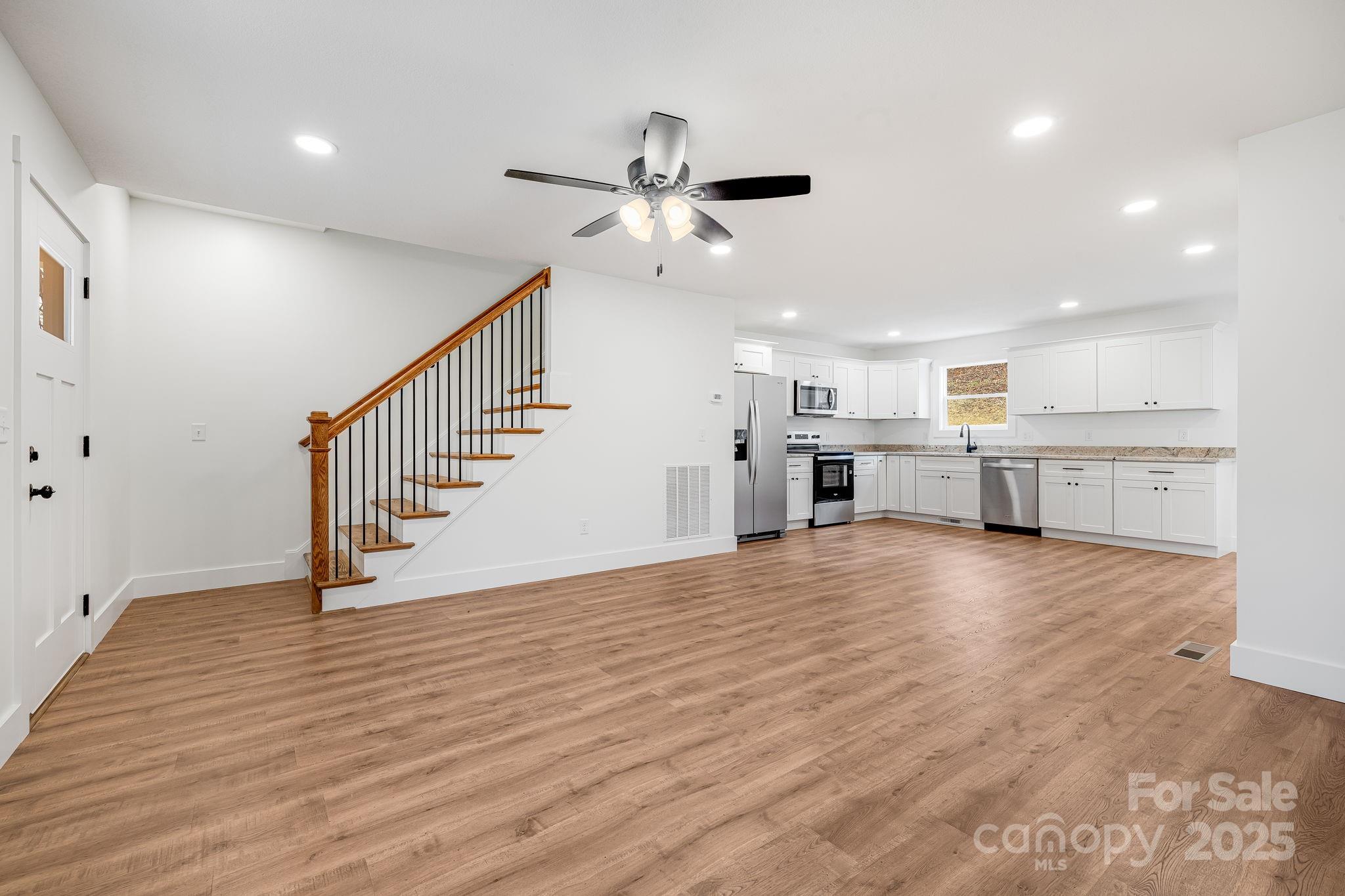 382 Holtzclaw Street Canton, NC 28716 - Photo 11 of 34 a view of kitchen with wooden floor and electronic appliances