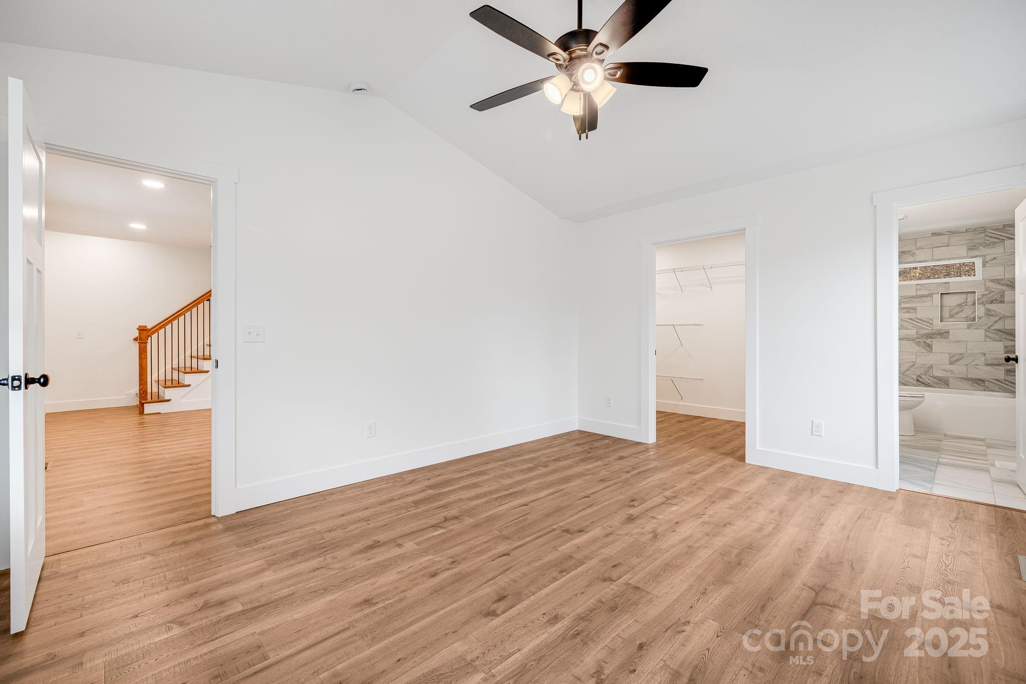 382 Holtzclaw Street Canton, NC 28716 - Photo 22 of 34 wooden floor in an empty room with a window