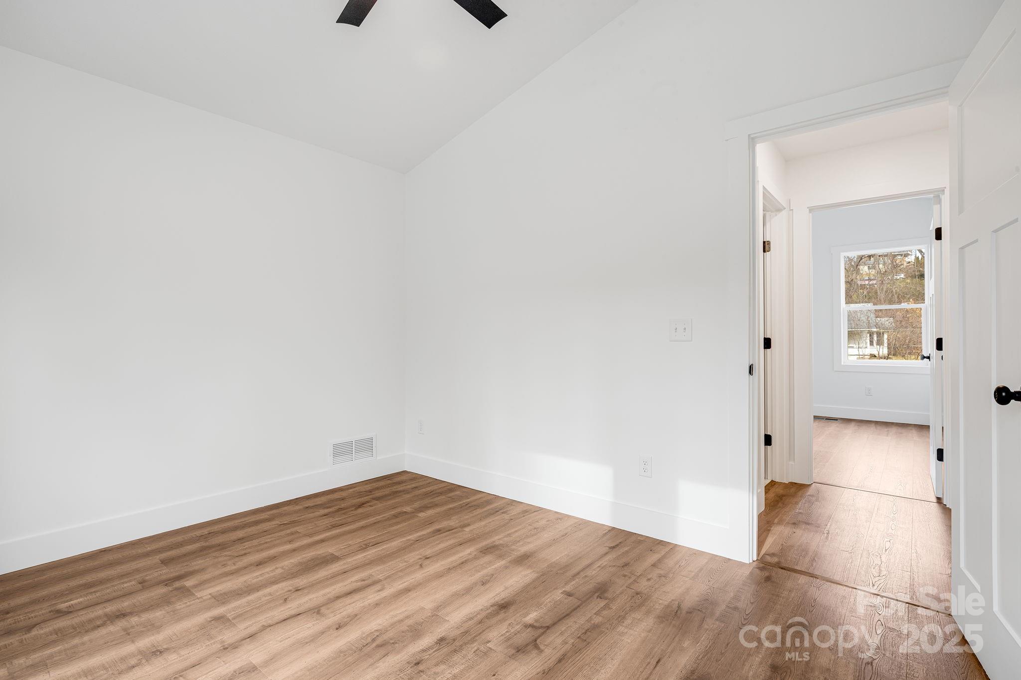 382 Holtzclaw Street Canton, NC 28716 - Photo 26 of 34 a view of empty room with wooden floor