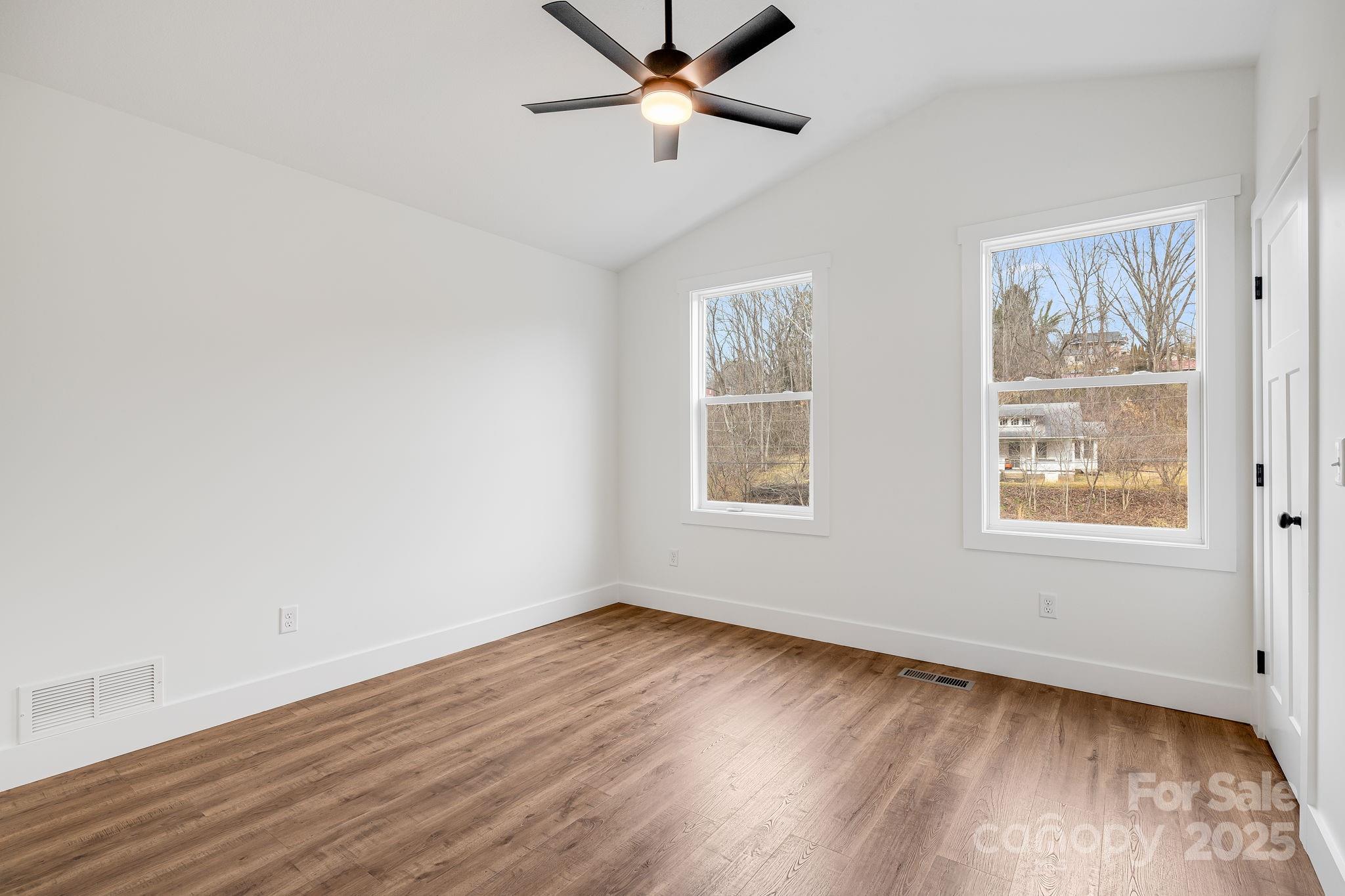 382 Holtzclaw Street Canton, NC 28716 - Photo 27 of 34 wooden floor in an empty room with a window
