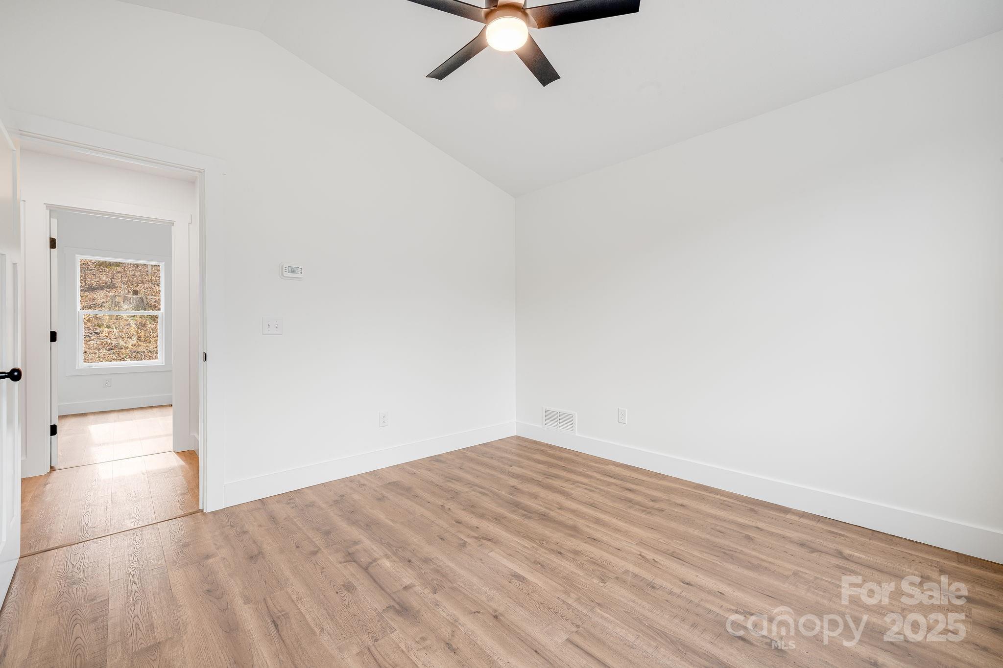 382 Holtzclaw Street Canton, NC 28716 - Photo 30 of 34 a view of empty room with wooden floor