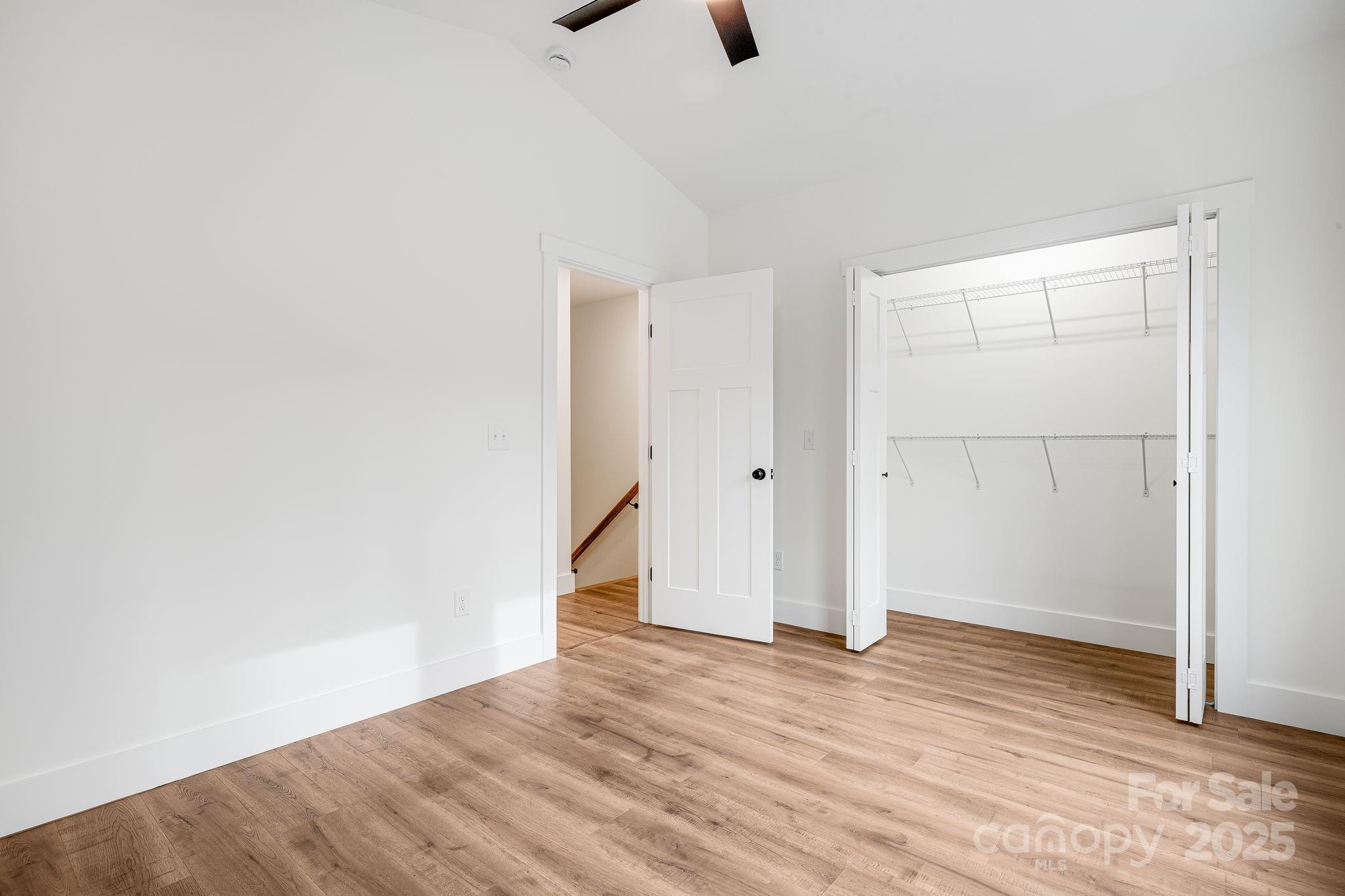 382 Holtzclaw Street Canton, NC 28716 - Photo 32 of 34 an empty room with closet and windows