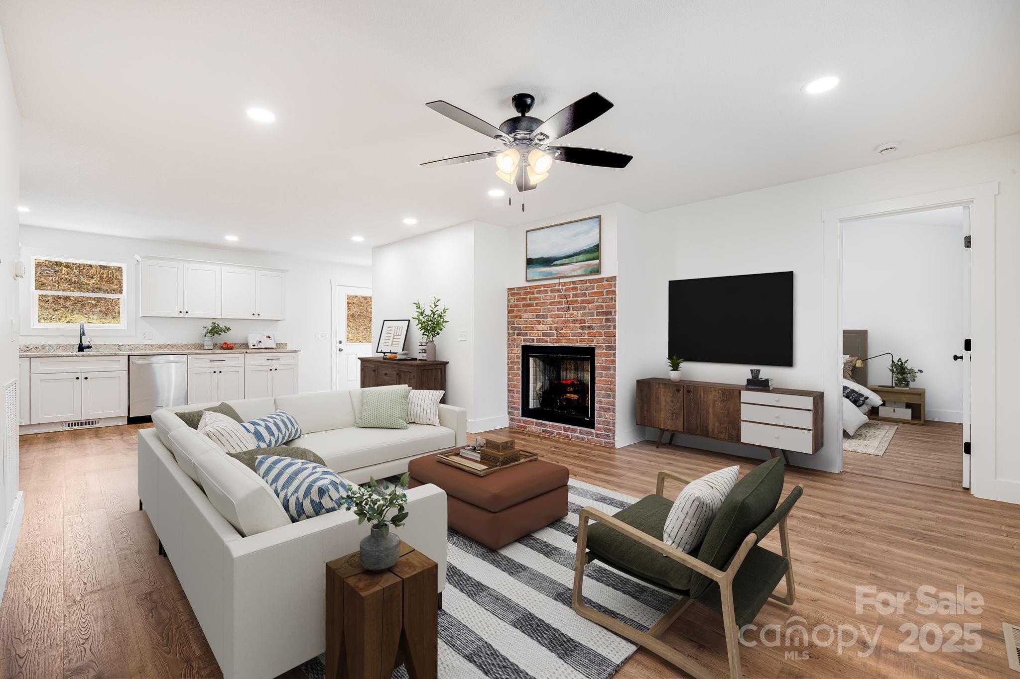 382 Holtzclaw Street Canton, NC 28716 - Photo 8 of 34 a living room with furniture and a fireplace