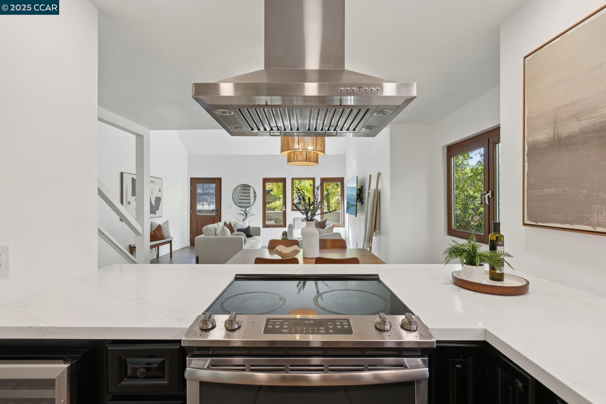 600 Suntree Lane, Unit 608 Pleasant Hill, CA 94523 - Photo 12 of 47 a view of a kitchen with kitchen island a large window cabinets a sink and stainless steel appliances