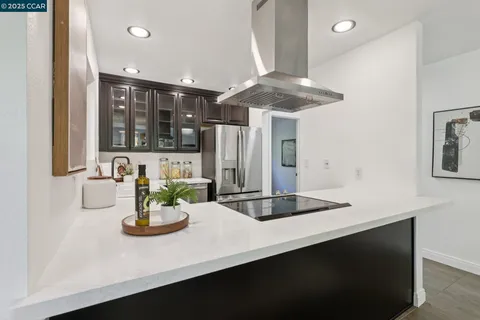 a bathroom with a double vanity sink window and mirror
