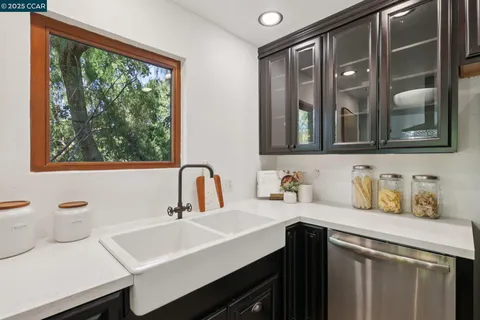 a room with a sink and a mirror