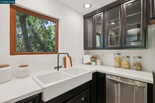 a room with a sink and a mirror