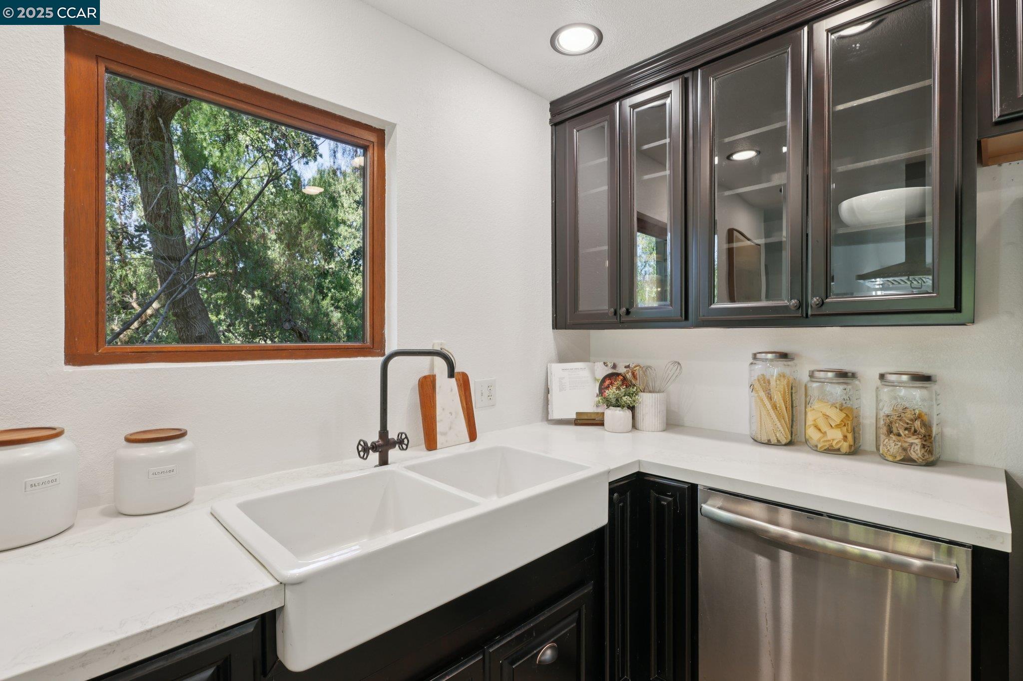 600 Suntree Lane, Unit 608 Pleasant Hill, CA 94523 - Photo 16 of 47 a bathroom with a double vanity sink window and mirror