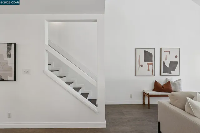 a bedroom with a bed and a night stand