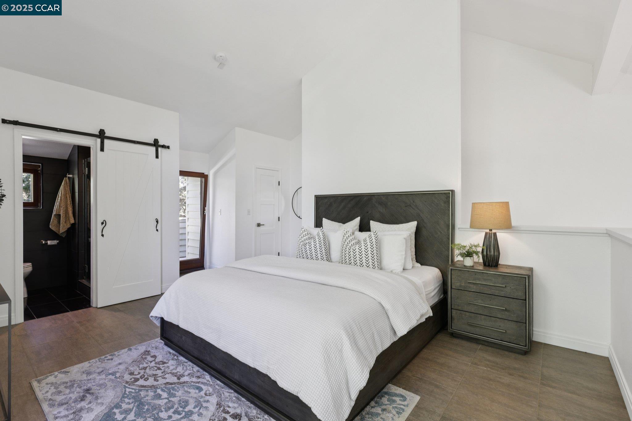 600 Suntree Lane, Unit 608 Pleasant Hill, CA 94523 - Photo 26 of 47 a bedroom with a bed and a night stand