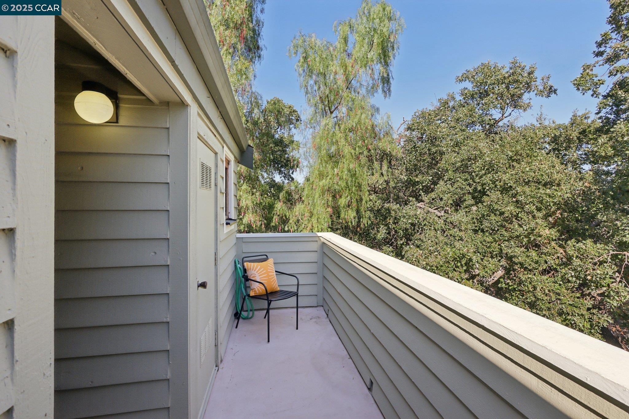 600 Suntree Lane, Unit 608 Pleasant Hill, CA 94523 - Photo 34 of 47 a view of balcony with wooden floor and bench