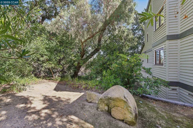 a view of a backyard with sitting area