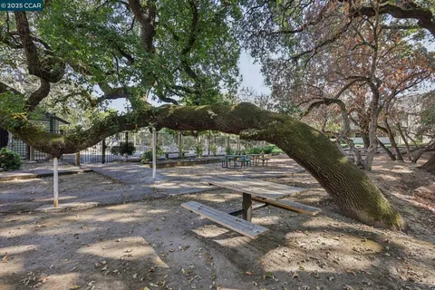 a view of a white house with a yard