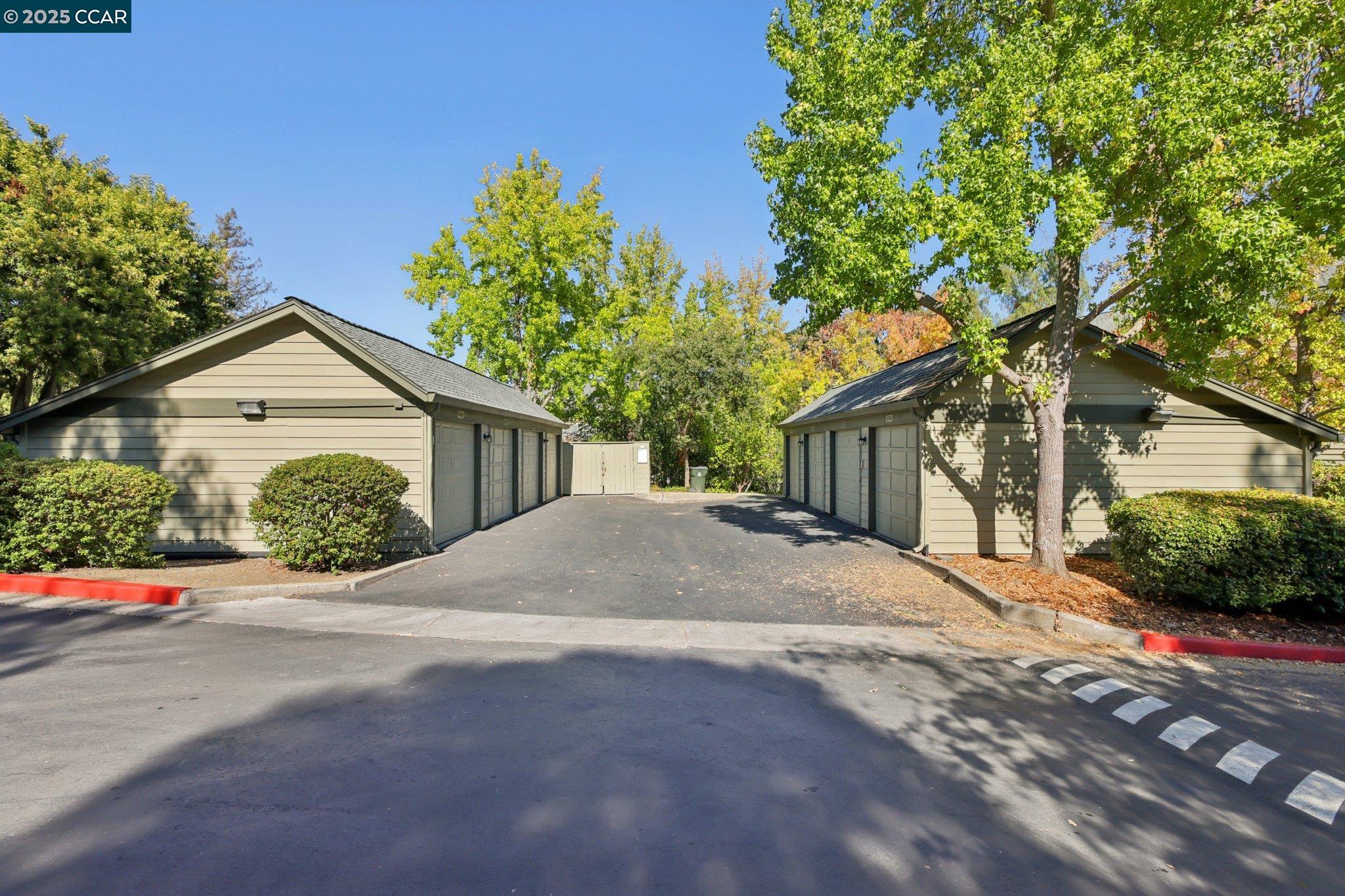 600 Suntree Lane, Unit 608 Pleasant Hill, CA 94523 - Photo 40 of 47 a front view of a house with a yard and garage