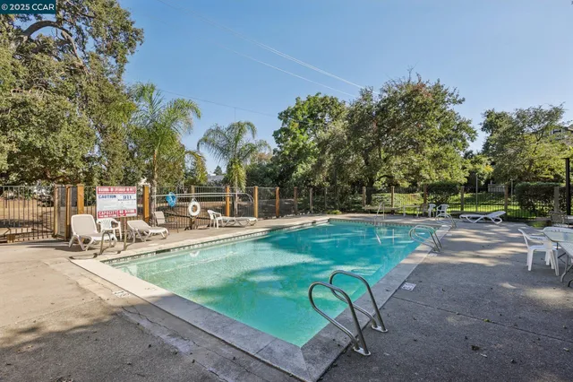 a view of a bench in a backyard