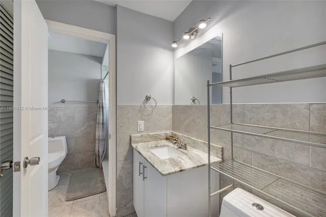 a bathroom with a sink and vanity