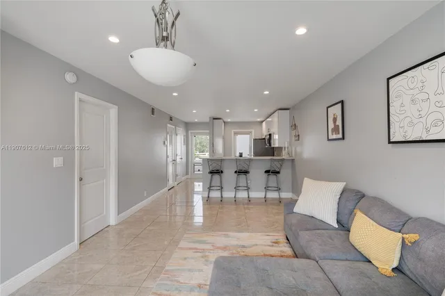 a living room with furniture and a table