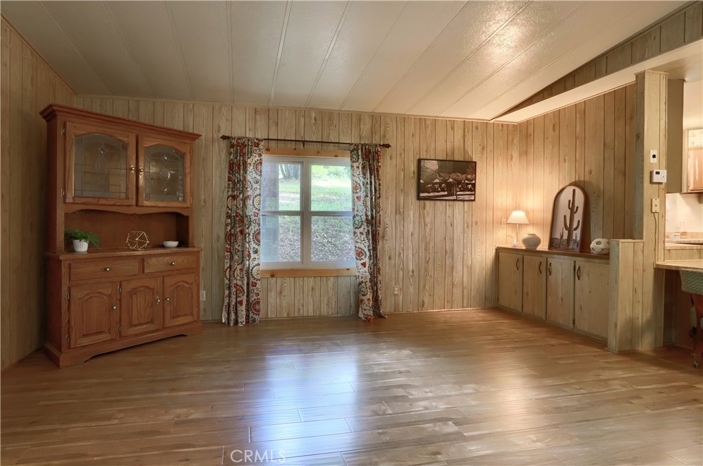 2843 East Westfall Road Mariposa, CA 95338 - Photo 10 of 47 a view of a kitchen with a sink cabinet and a living room