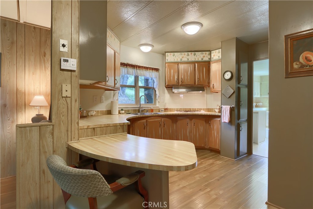 2843 East Westfall Road Mariposa, CA 95338 - Photo 11 of 47 a view of a dining room with furniture and a chandelier
