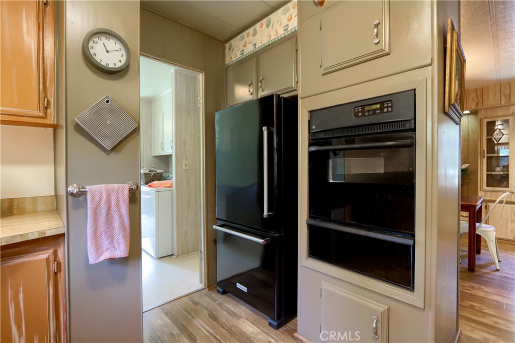 2843 East Westfall Road Mariposa, CA 95338 - Photo 13 of 47 a view of a kitchen with refrigerator and cabinets