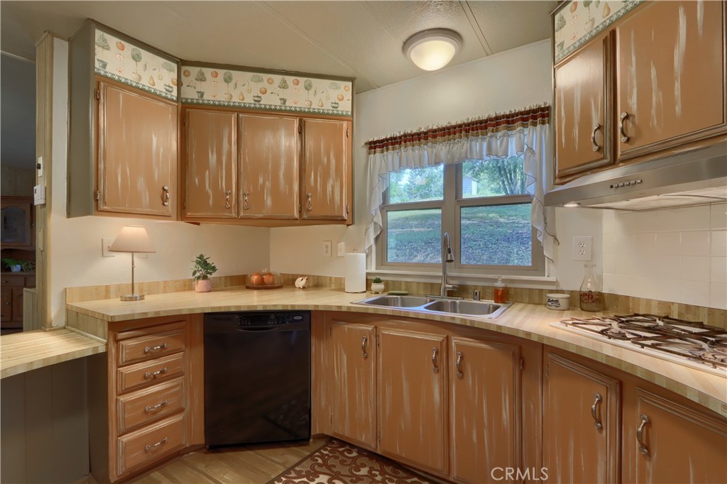 2843 East Westfall Road Mariposa, CA 95338 - Photo 14 of 47 a kitchen with a sink stove and cabinets
