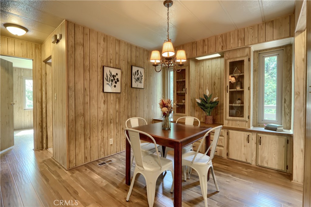 2843 East Westfall Road Mariposa, CA 95338 - Photo 16 of 47 a view of a dining room with furniture window and wooden floor
