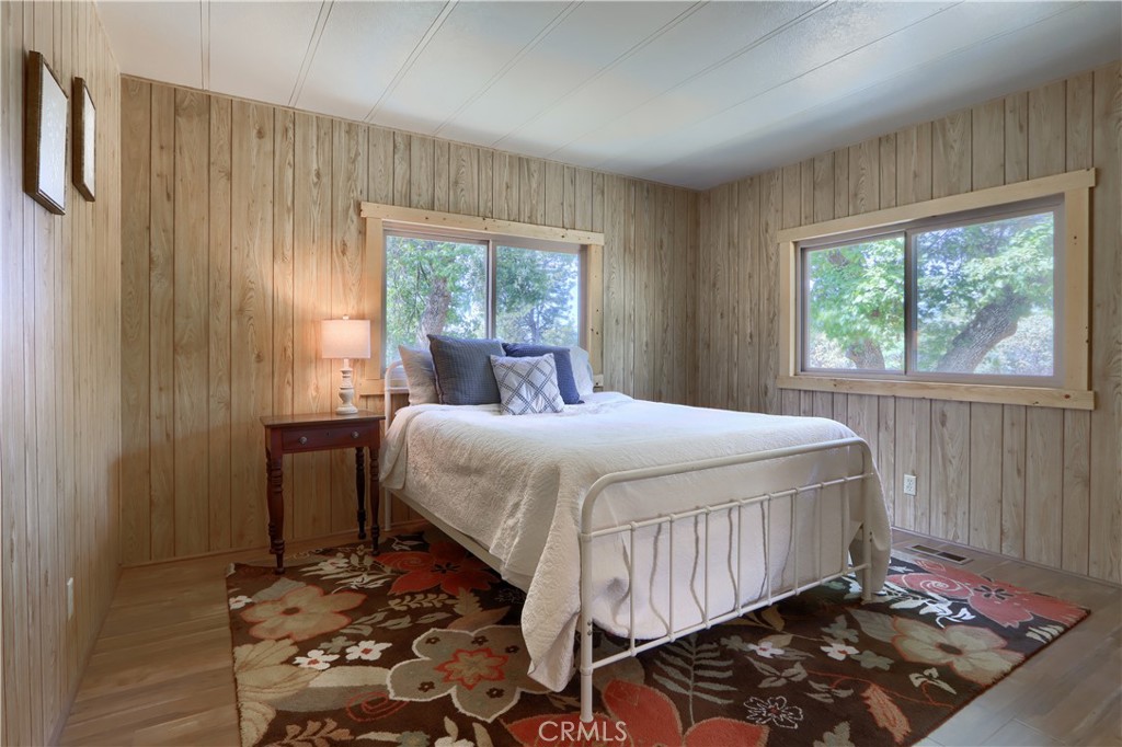 2843 East Westfall Road Mariposa, CA 95338 - Photo 18 of 47 a bedroom with a bed and wooden floor