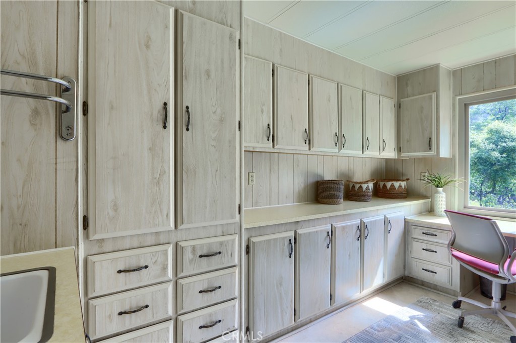 2843 East Westfall Road Mariposa, CA 95338 - Photo 29 of 47 a view of cabinets a sink and a window in a room