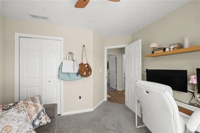 a bedroom with a bed and cabinets