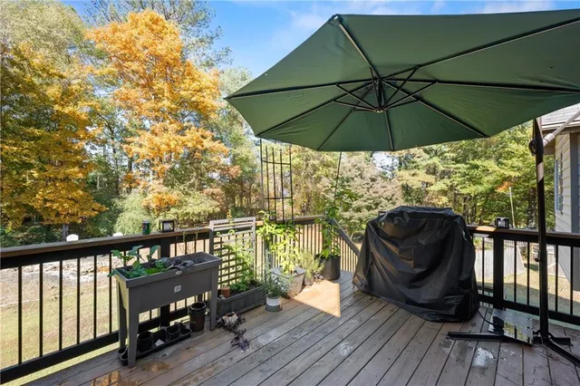a view of balcony with furniture and wooden floor