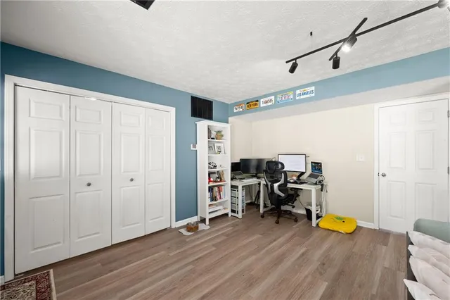 a view of a room with wooden roof and windows