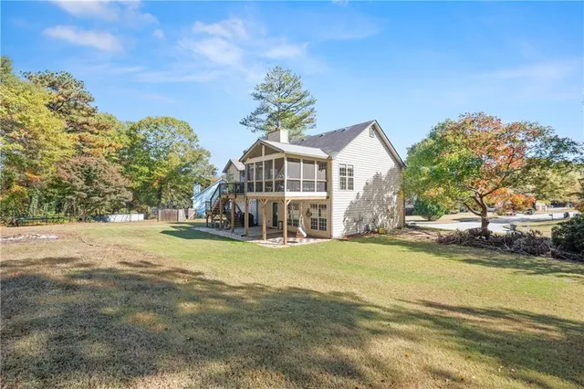 a view of yard with large trees