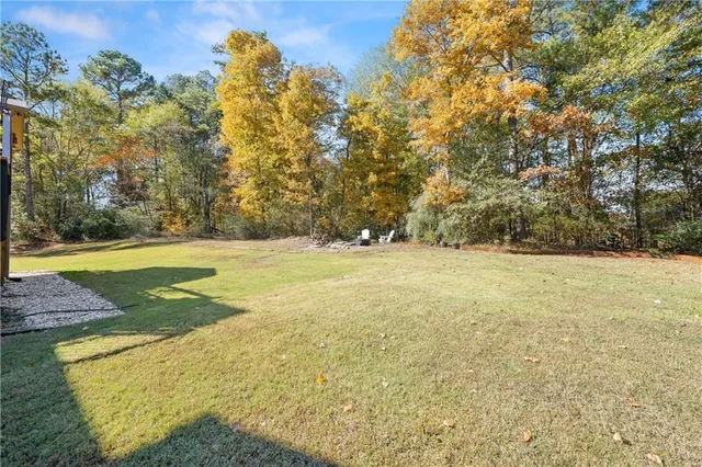 an aerial view of residential building with green space