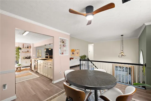 a living room with furniture and kitchen view