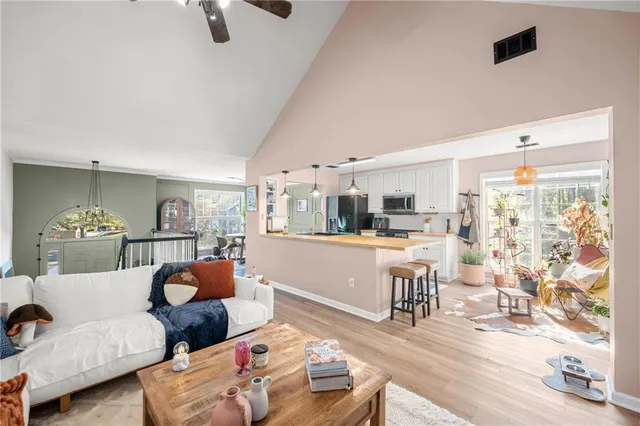 a living room with furniture and a table