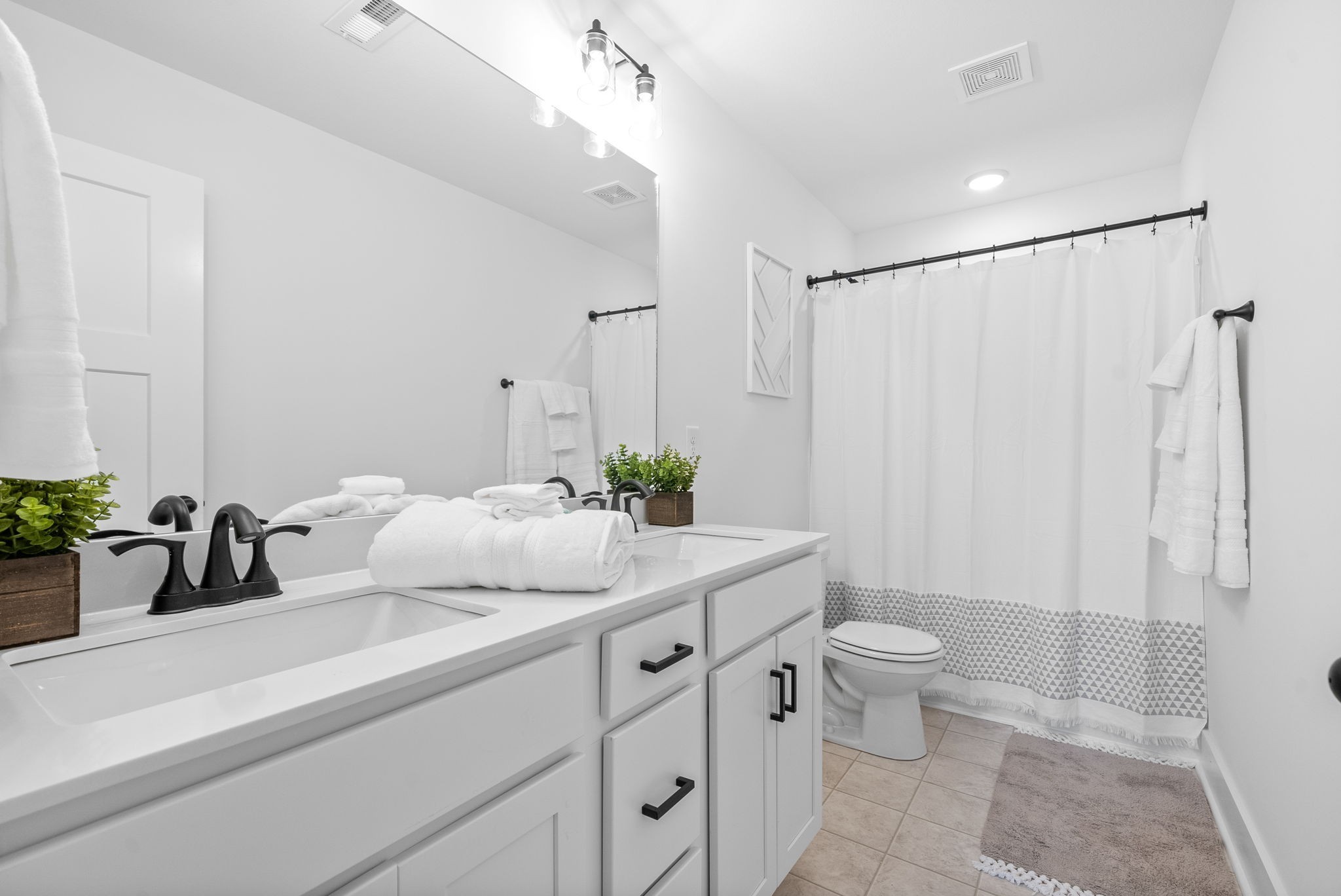 333 Front Ridge Circle Clarksville, TN 37042 - Photo 14 of 30 Primary bathroom with dual vanities, custom cabinets and marble counters