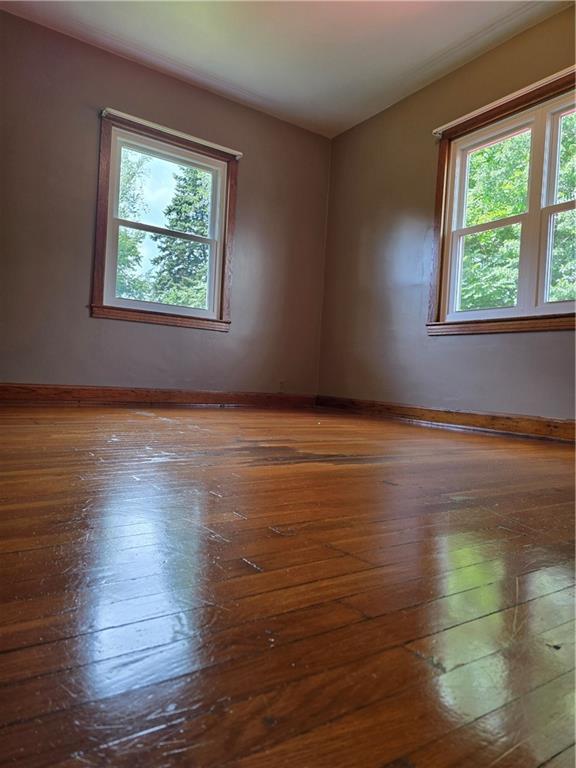 368 Pittsburgh Road Butler, PA 16002 - Photo 21 of 26 an empty room with wooden floor and windows