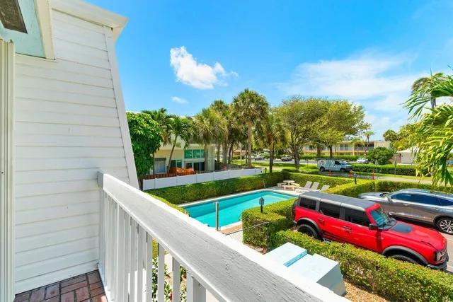 a view of yard with swimming pool and outdoor seating