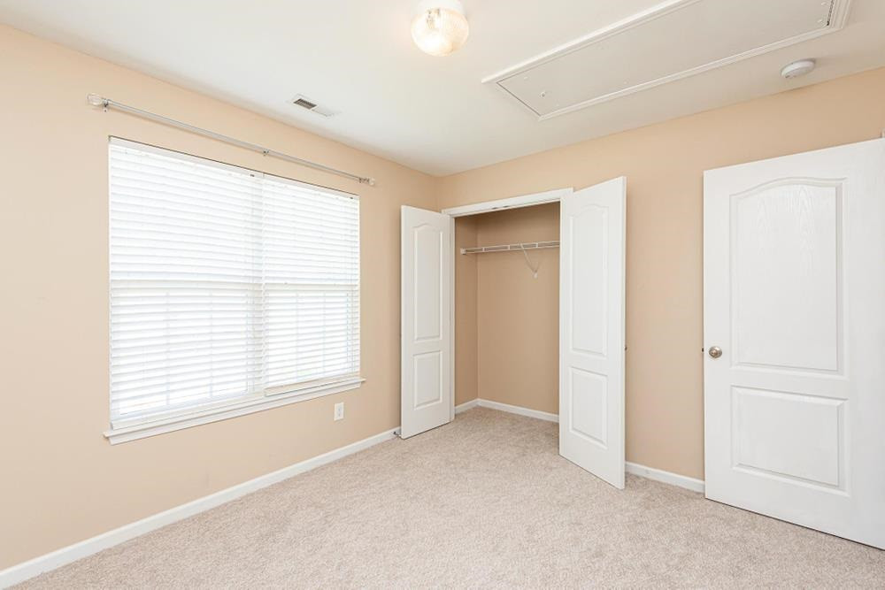 3519 Oneonta Avenue Raleigh, NC 27604 - Photo 21 of 30 Bedroom 2 closet and view of pull down attic location. Bedroom 2