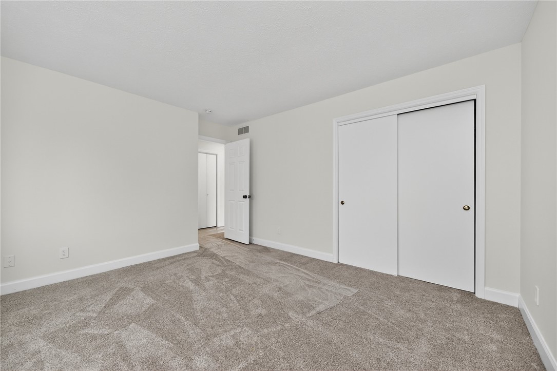 811 Wind Bluff Point Springboro, OH 45066 - Photo 29 of 51 This inviting bedroom features soft carpeting and ample closet space, providing a comfortable living area.