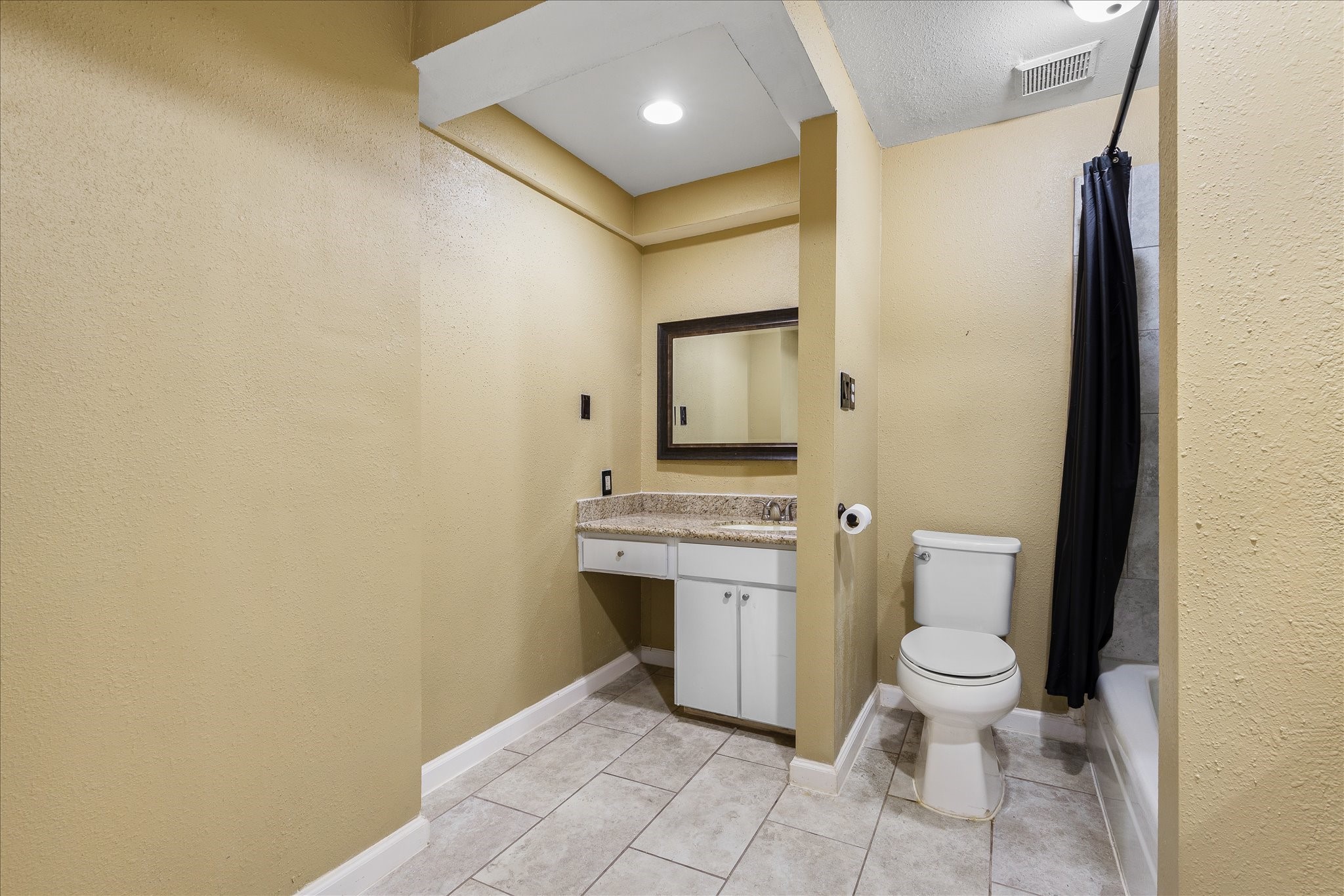 1425 Springrock Lane Houston, TX 77055 - Photo 18 of 30 a bathroom with a toilet sink and mirror