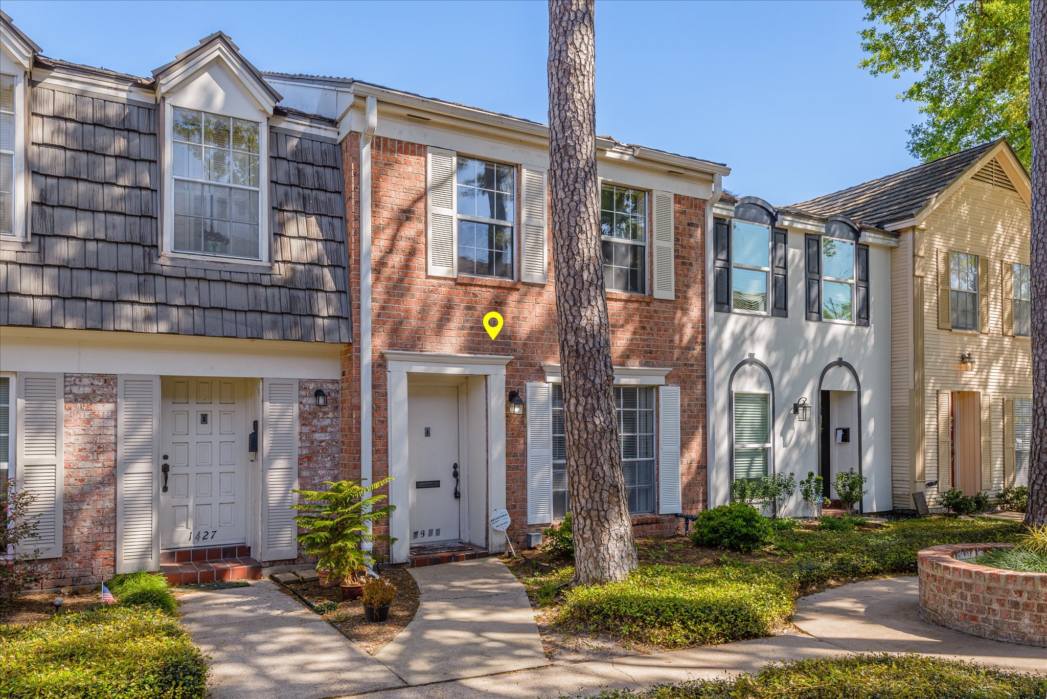 1425 Springrock Lane Houston, TX 77055 - Photo 2 of 30 a front view of a building with yard