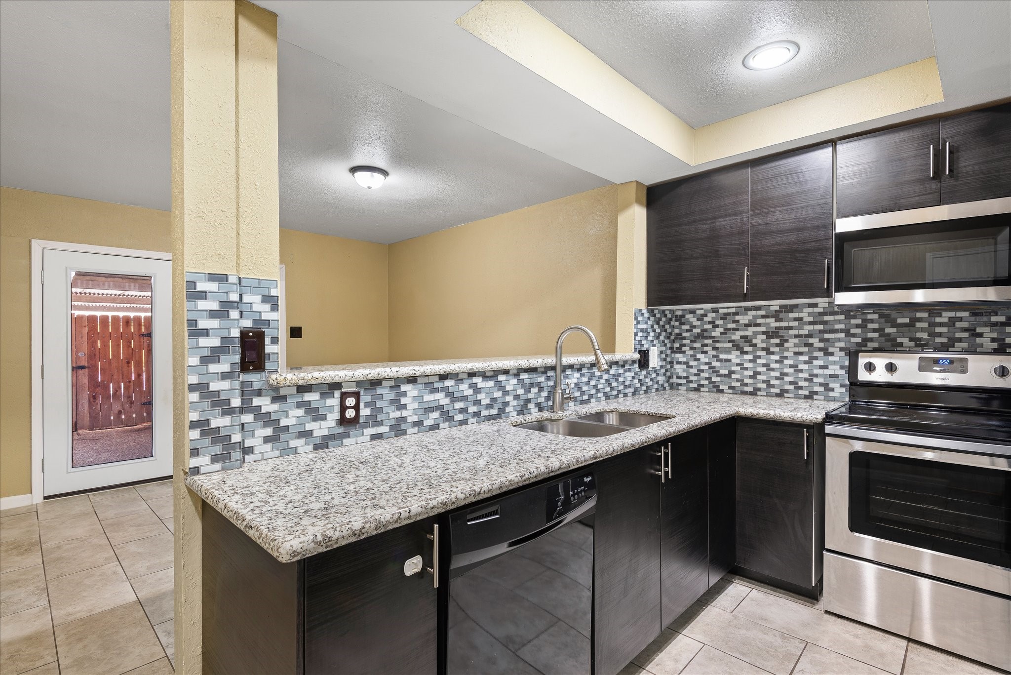 1425 Springrock Lane Houston, TX 77055 - Photo 9 of 30 a kitchen with a sink and stove