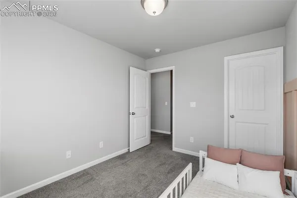 a view of a room with furniture and wooden floor