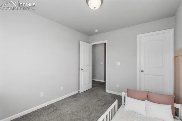 a view of a room with furniture and wooden floor