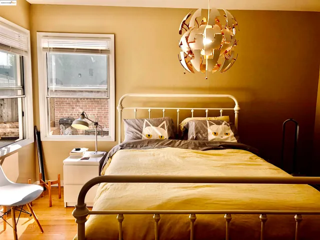 a bedroom with a bed and glass windows