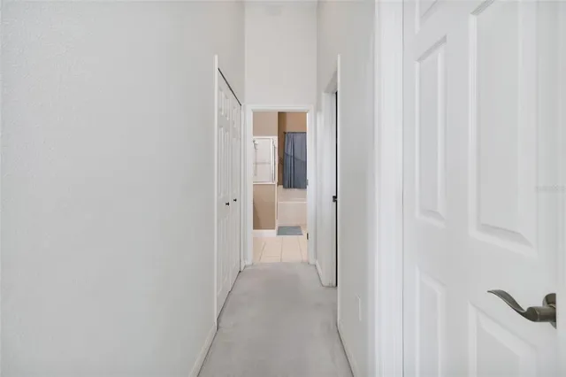 a view of a hallway with closet and entryway
