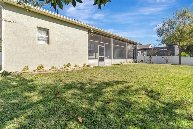 a view of an house with backyard space and garden