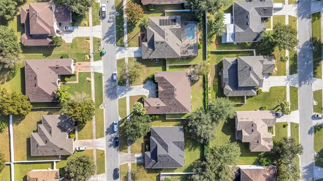an aerial view of houses with outdoor space